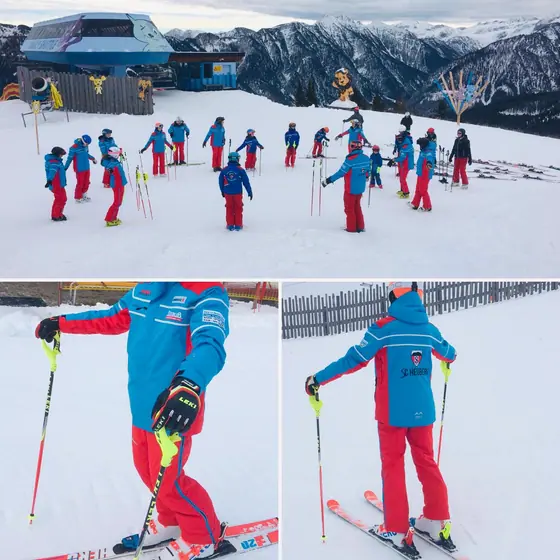 Skischulgruppe mit Kindern in blau-roter Teambekleidung am Übungshang